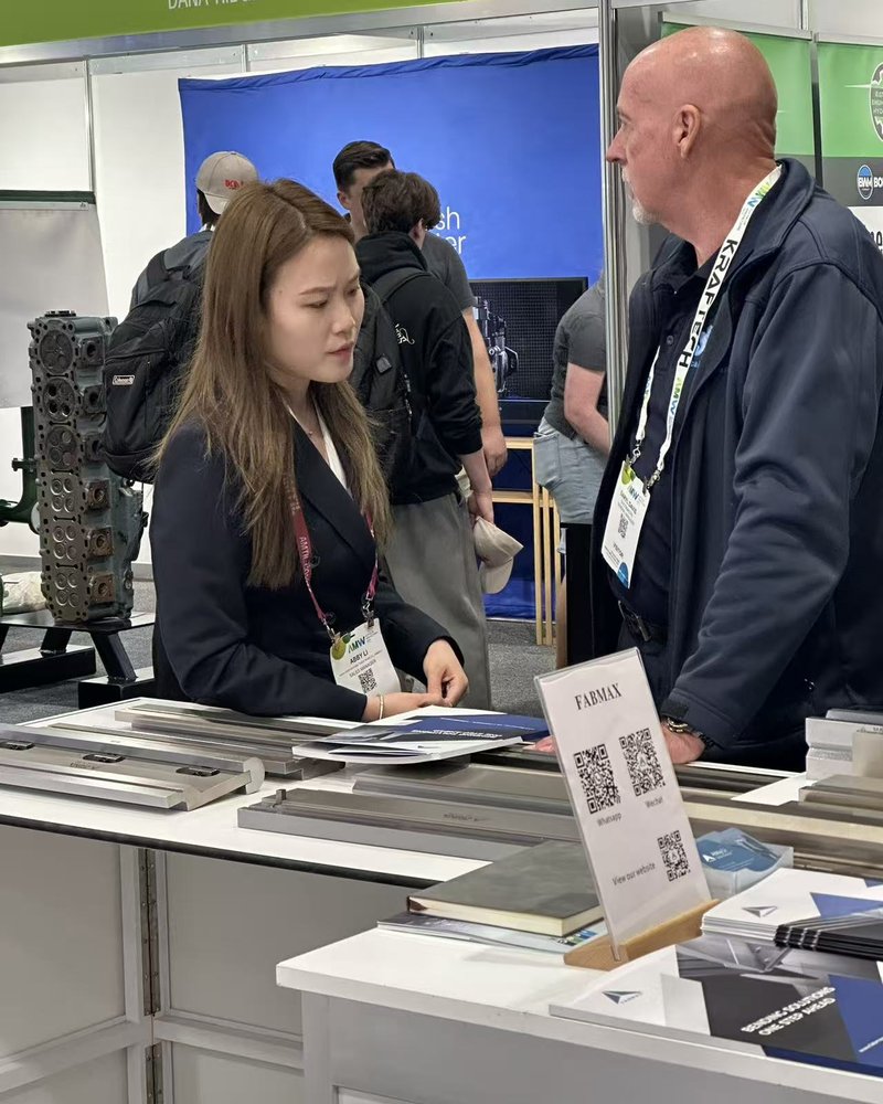 Fabmax sales manager meeting a customer at AMW 2026 Brisbane Stand 2945